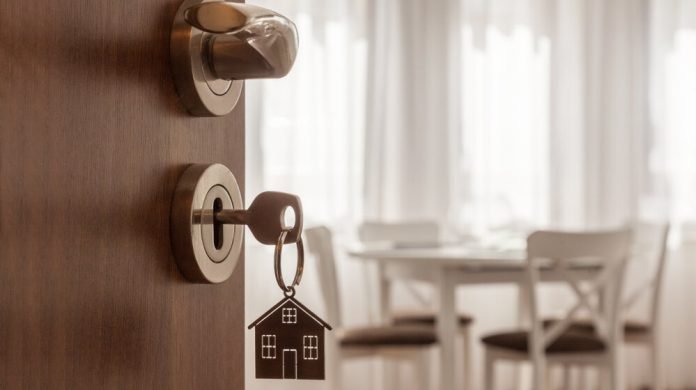 Open,Door,To,A,New,Home.,Door,Handle,With,Key
